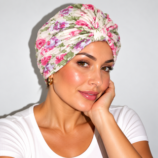 Woman wearing a floral hair loss chemo turban