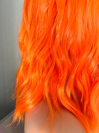 "Rae" - Short Neon Orange Wig With Bangs