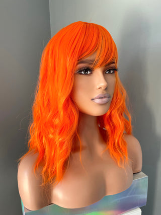 "Rae" - Short Neon Orange Wig With Bangs