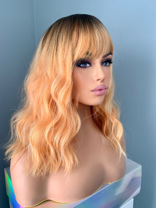"Cora" - Coral Peach Orange Wig with Bangs